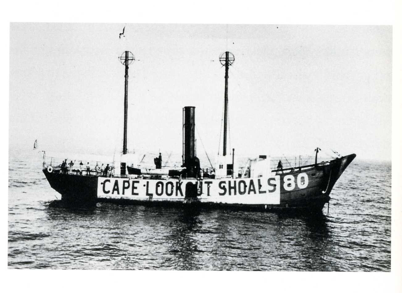 light ship anchored offshore with sign reading Cape Lookout Shoals off its starboard side