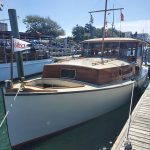 wooden boat in water named best inboard power