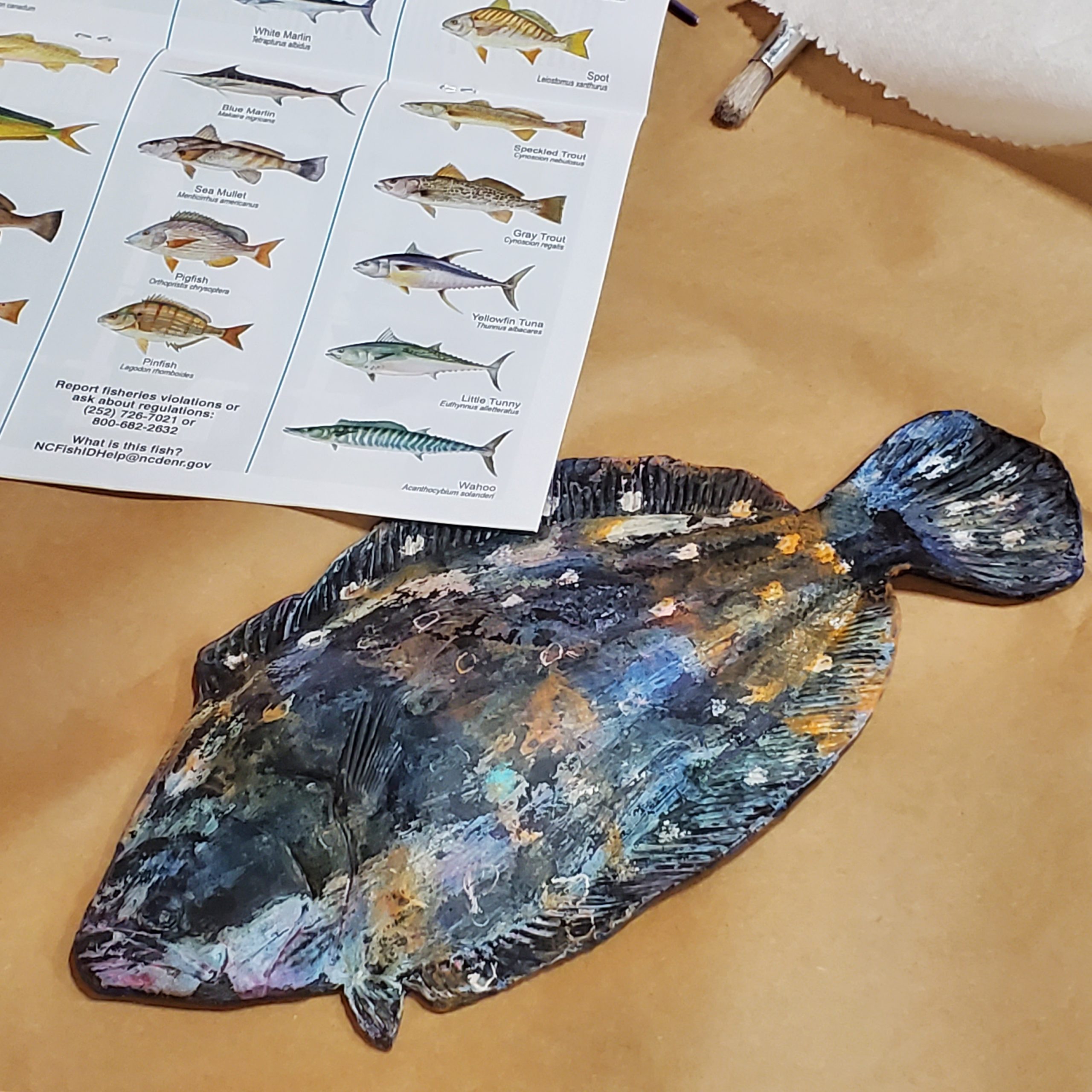 a fish model covered in various shades of paint